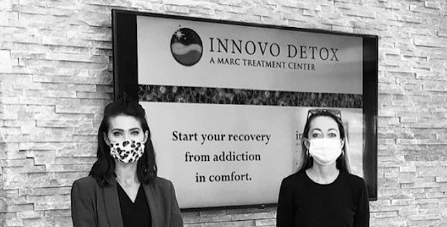 Mallorie & Molly in front of sign - innovo detox 2020 concept image