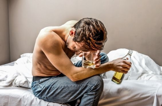 man struggling with alcohol addiction - need for Detox and Treatment concept image