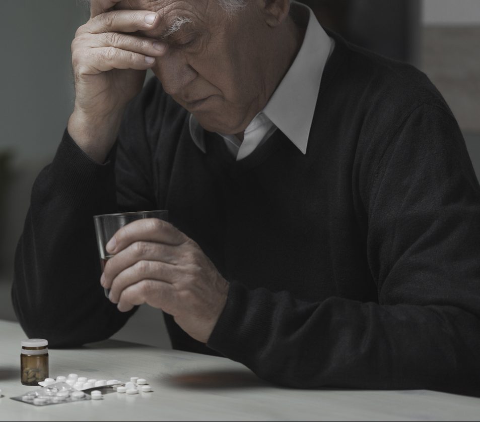 Elderly Man abusing Medication - Medication Mismanagement Concept image