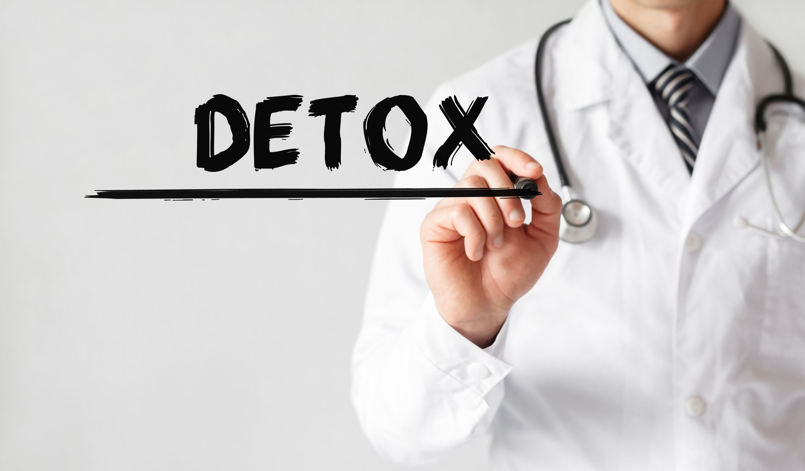 Doctor writing word Detox with marker, Medical - prepare for drug and alcohol detox