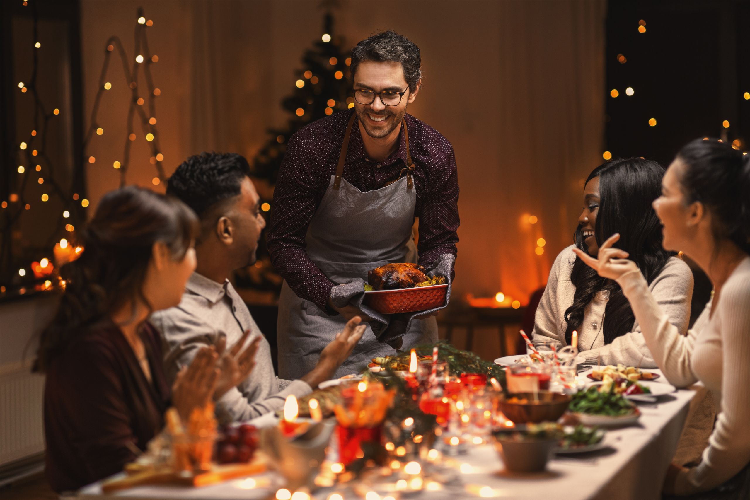 sober approach to the holidays concept - family at dinner table